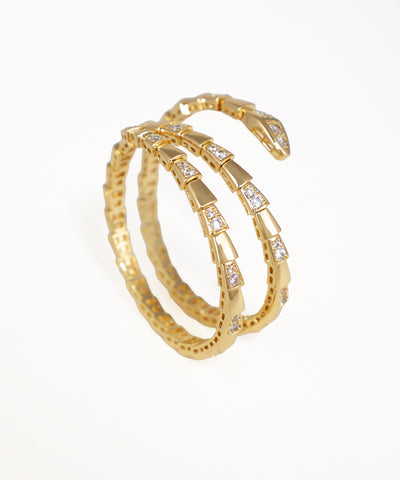 Gold-tone Bangle Kada with sparkling clear stones in a serpentine wrap design