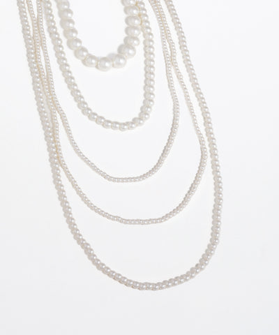 Set of pearl necklaces on a white background