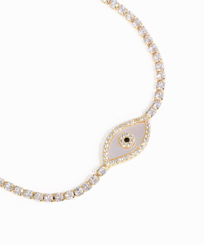 Necklace with an eye-shaped pendant and diamond-like stones on a white background