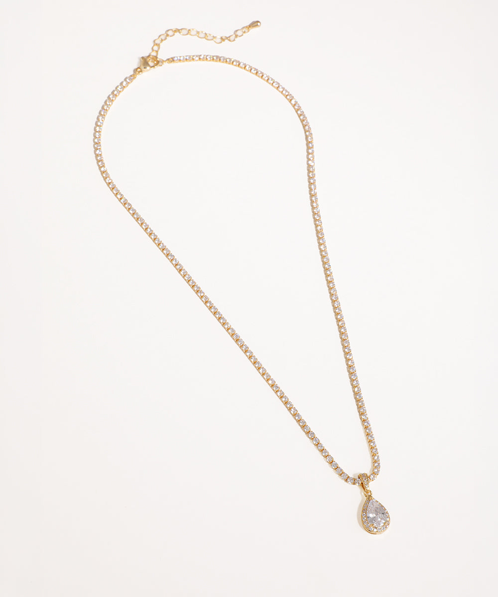 Gold-tone necklace with a sparkling stone-studded chain and a pear-shaped CZ pendant