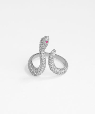 Silver snake-shaped ring with a pink gemstone on a white background