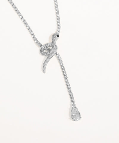 Silver snake-shaped pendant necklace on a white background