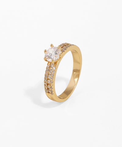 Gold ring with a diamond on a white background