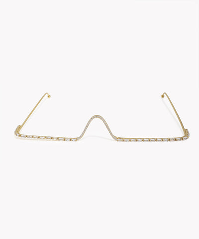 Gold-tone facelet with central wave design and clear baguette and pavé CZ stones.