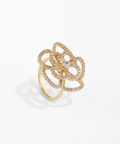 Gold ring with diamond accents on a white background