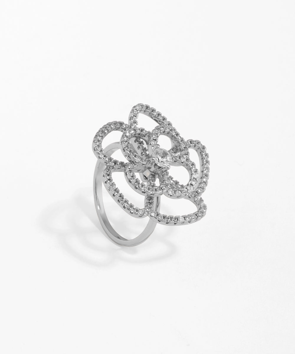 Silver ring with floral design on a white background