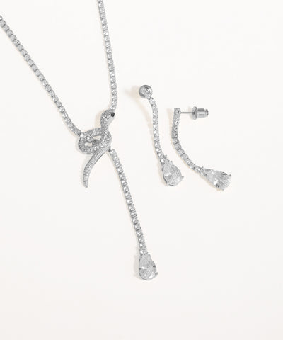 Silver jewelry set with necklace and earrings on a white background