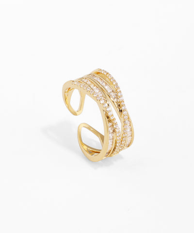 Gold-tone open ring with multiple bands encrusted with cubic zirconia stones and a sparkling finish.