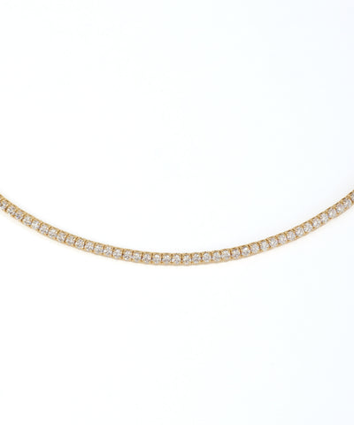 Gold necklace with diamonds on a white background