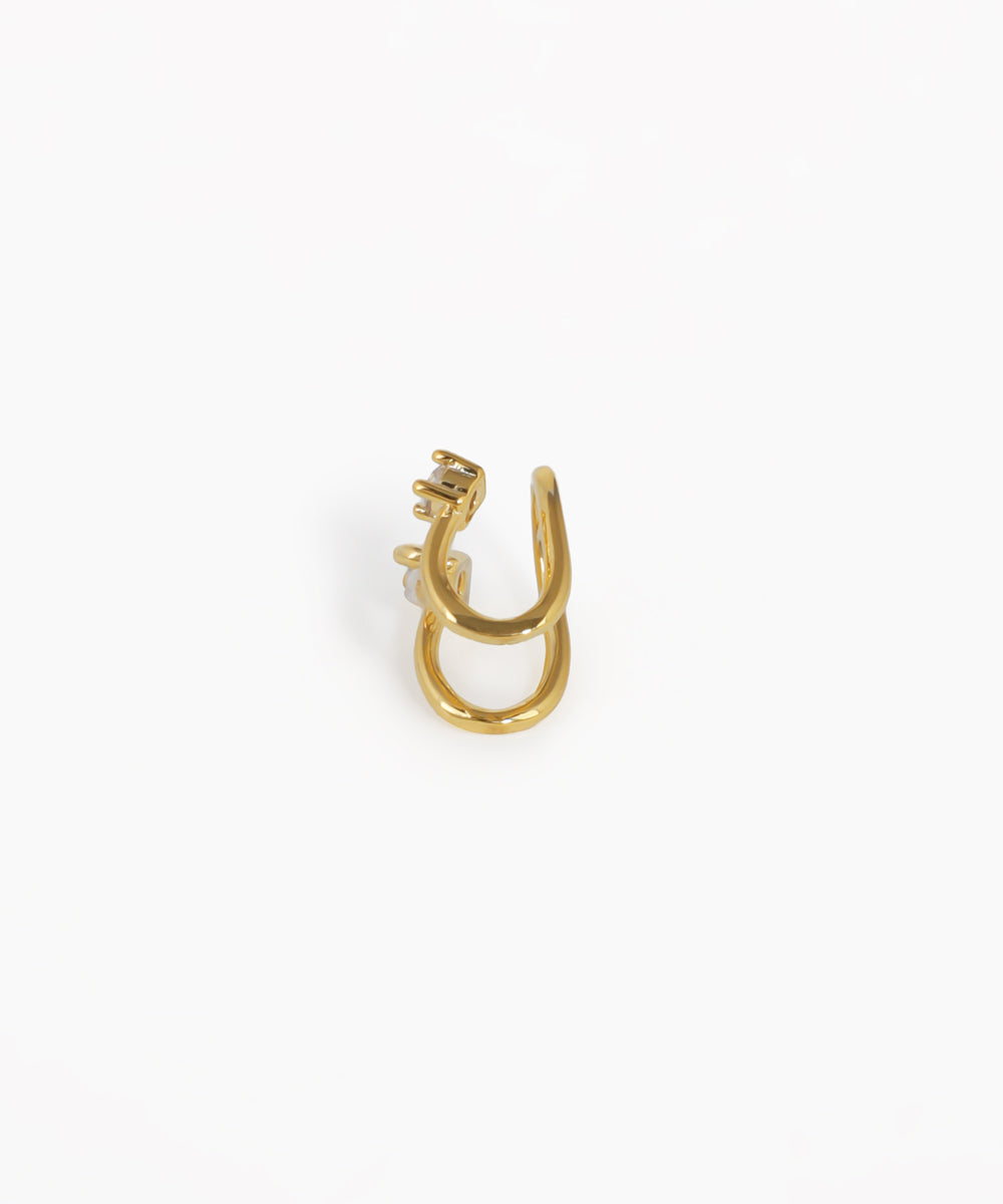 Gold earring on a white background