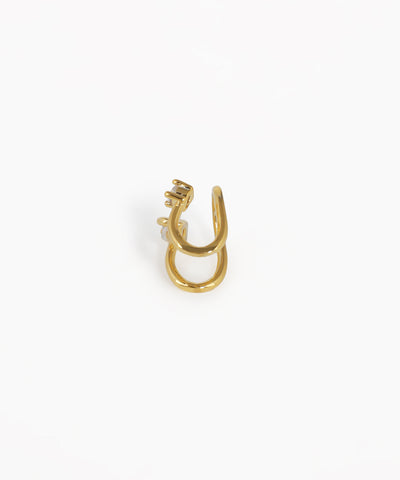 Gold earring on a white background