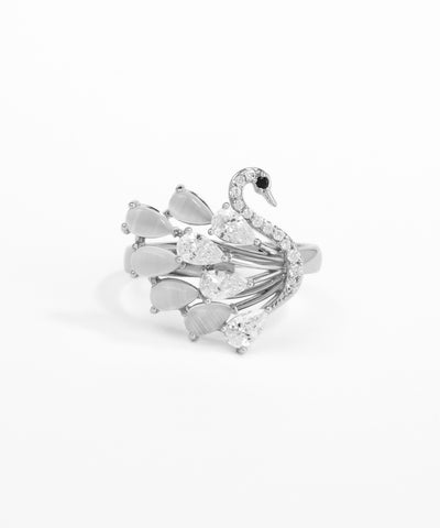 Silver swan-shaped ring with gemstones on a white background