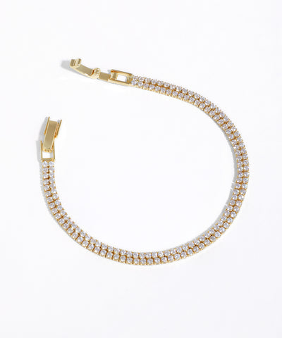 Gold-tone bracelet with two rows of clear cubic zirconia stones and a box clasp closure.