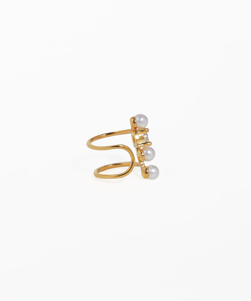 Gold ring with pearls on a white background