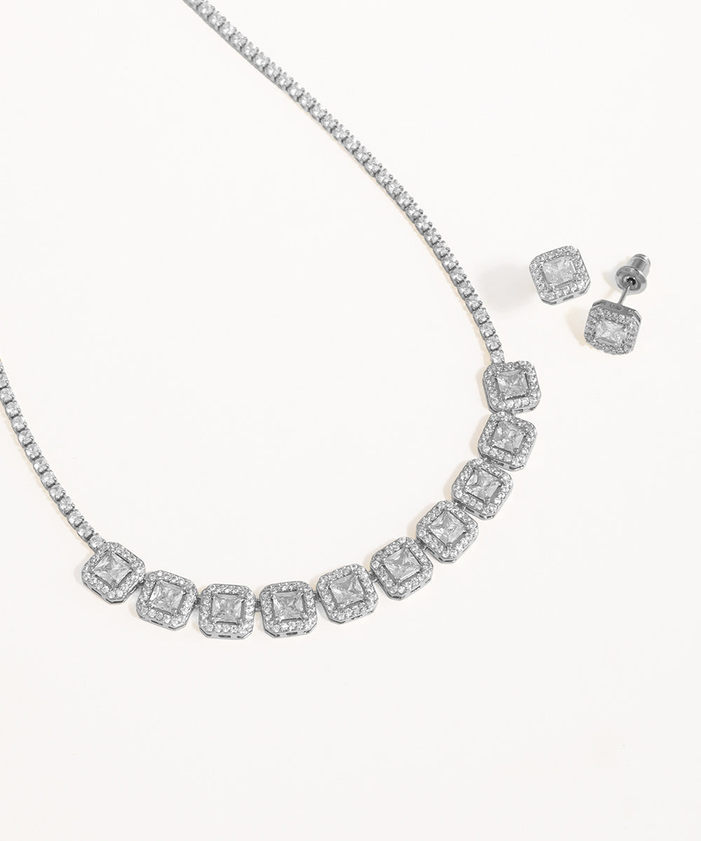 Diamond necklace and earrings on a white background