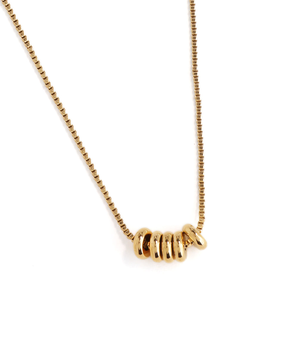 Gold necklace with a unique clasp design on a white background
