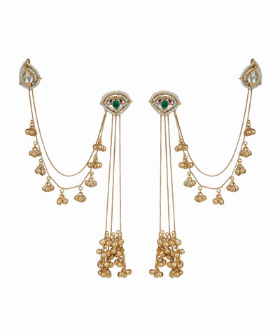 Pair of gold earrings with green gemstones on a white background
