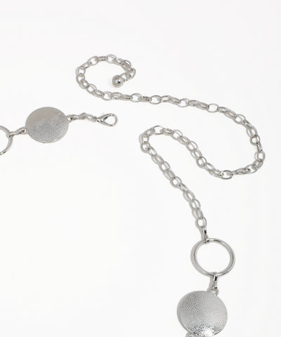 Silver necklace with circular pendants on a white background