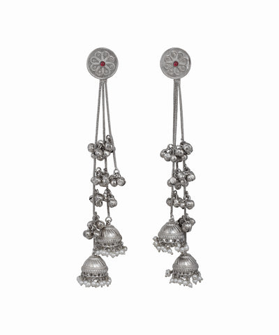 Pair of silver earrings with hanging components on a white background