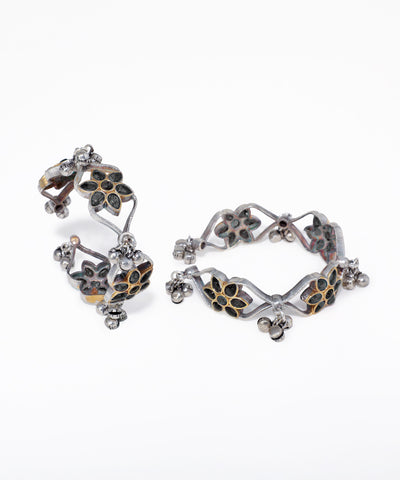Pair of floral earrings on a white background