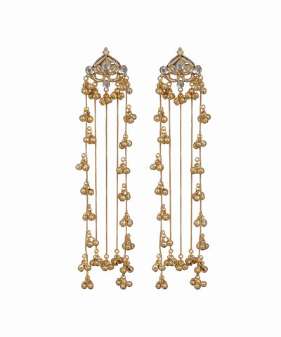 Gold earrings with dangling beads on a white background