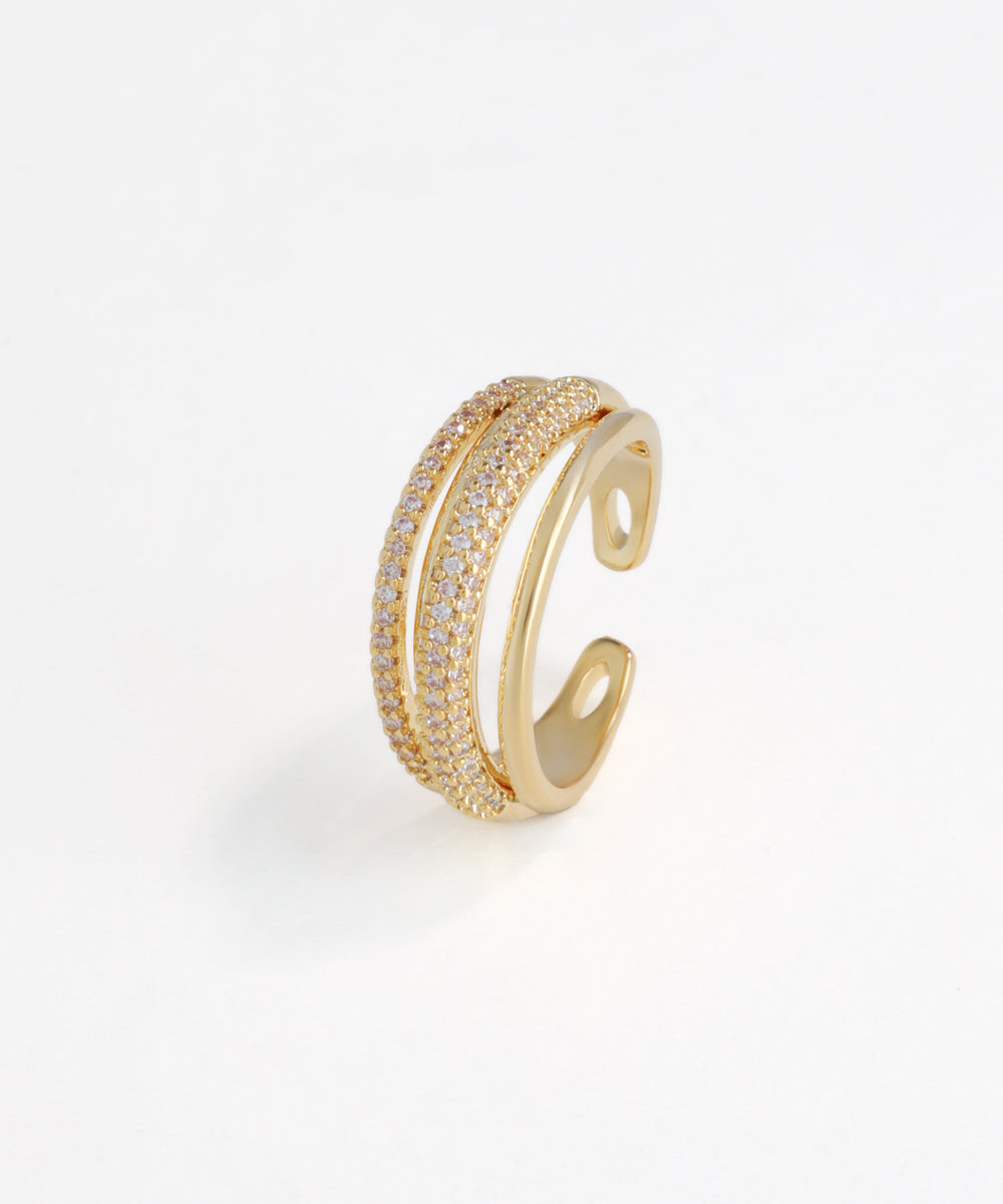 Gold open ring with embedded diamonds on a white background