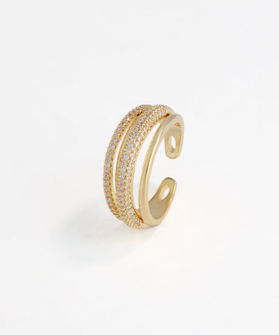 Gold open ring with embedded diamonds on a white background