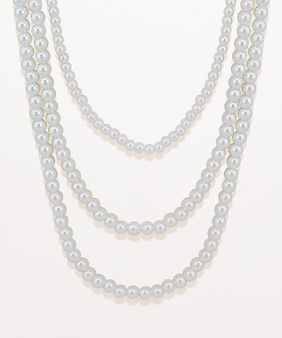 Two pearl necklaces on a white background