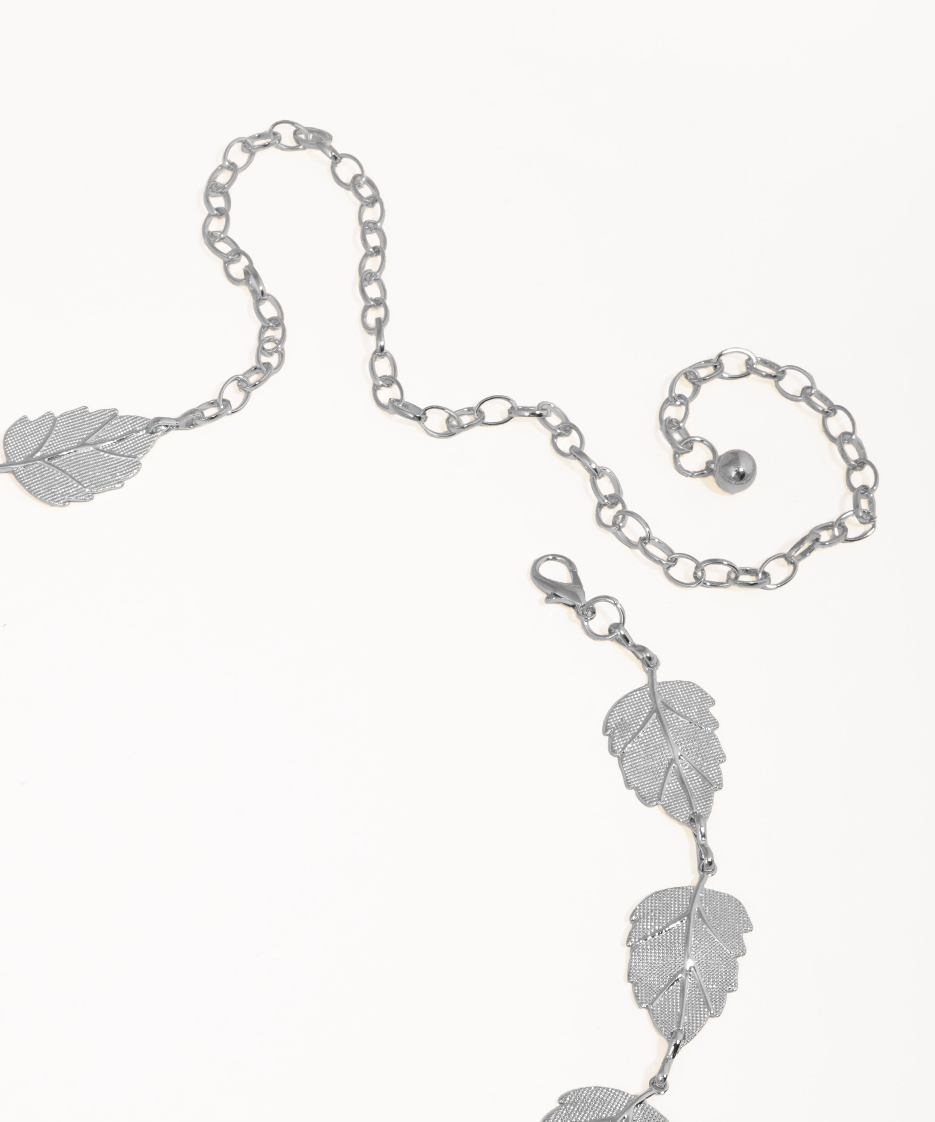 Silver leaf-themed bracelet on a white background