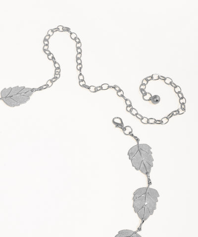 Silver leaf-themed bracelet on a white background