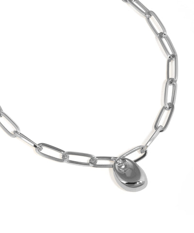 Silver chain necklace with a heart-shaped pendant on a white background