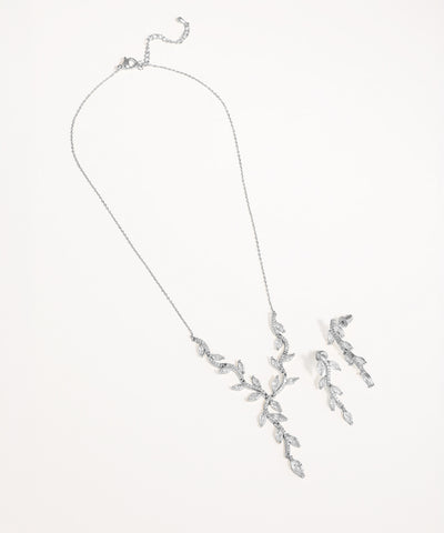 Silver necklace with leaf-like design on a white background