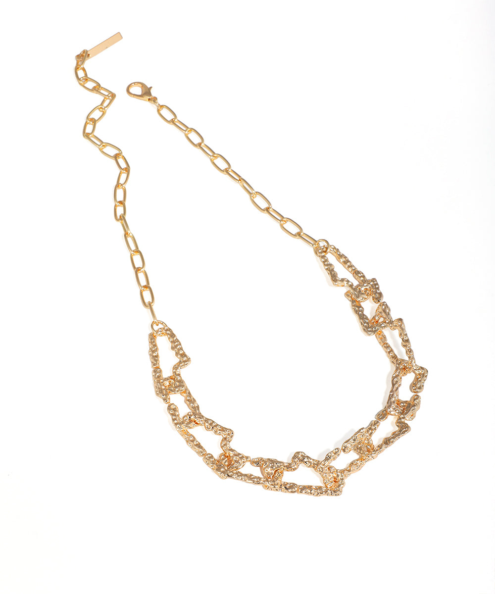 Gold-tone necklace with chunky organic textured links and extender chain