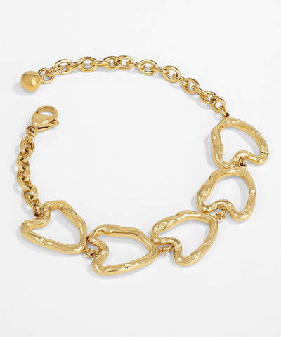 Gold chain bracelet with heart-shaped links on a white background