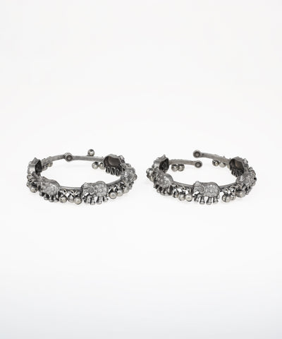 Oxidised silver-tone bangle bracelet with elephant motifs and small clear stones