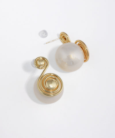 Gold-tone earrings with abstract wire swirl and large faux pearl orb