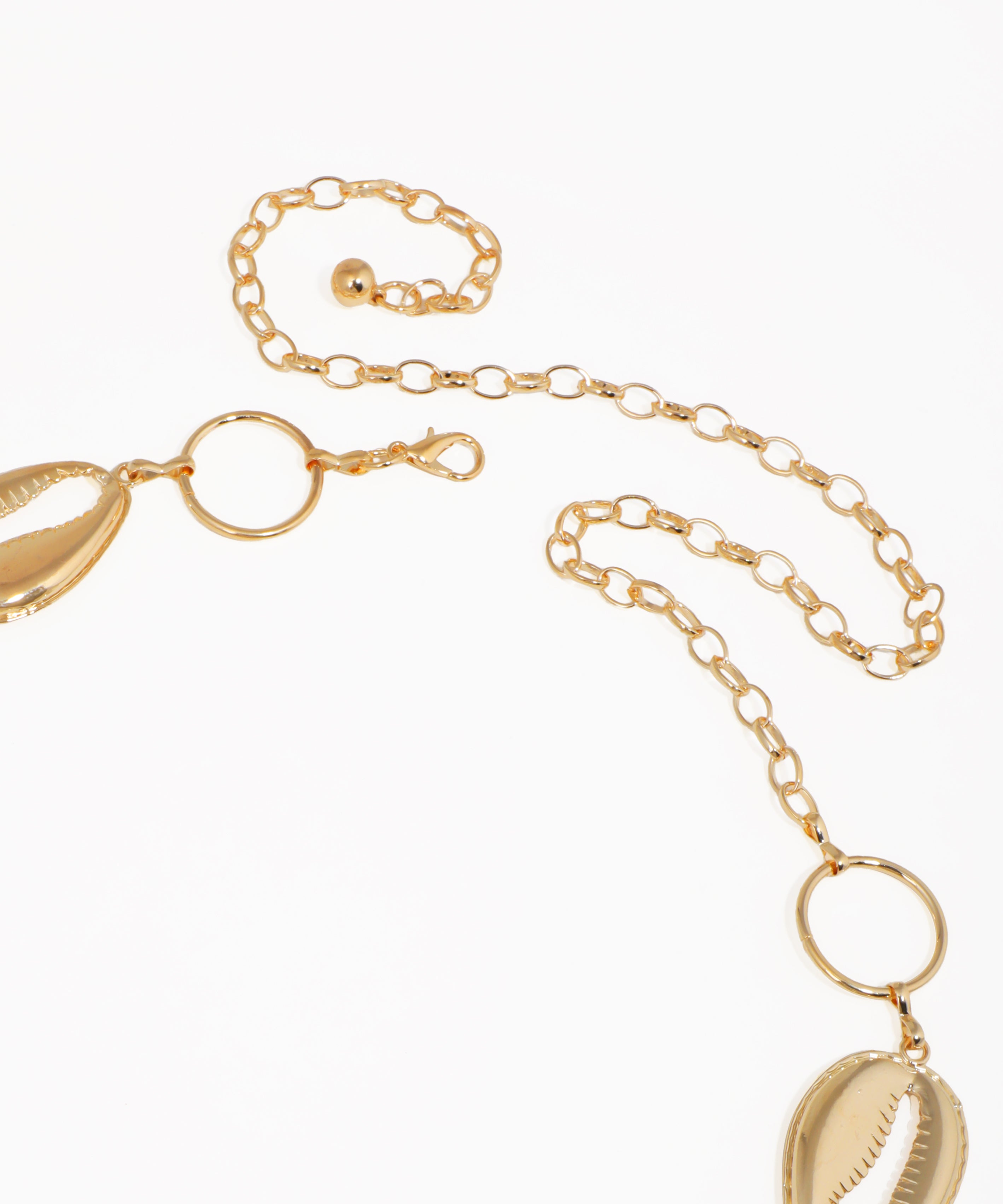 Gold necklace with leaf-shaped pendants on a white background