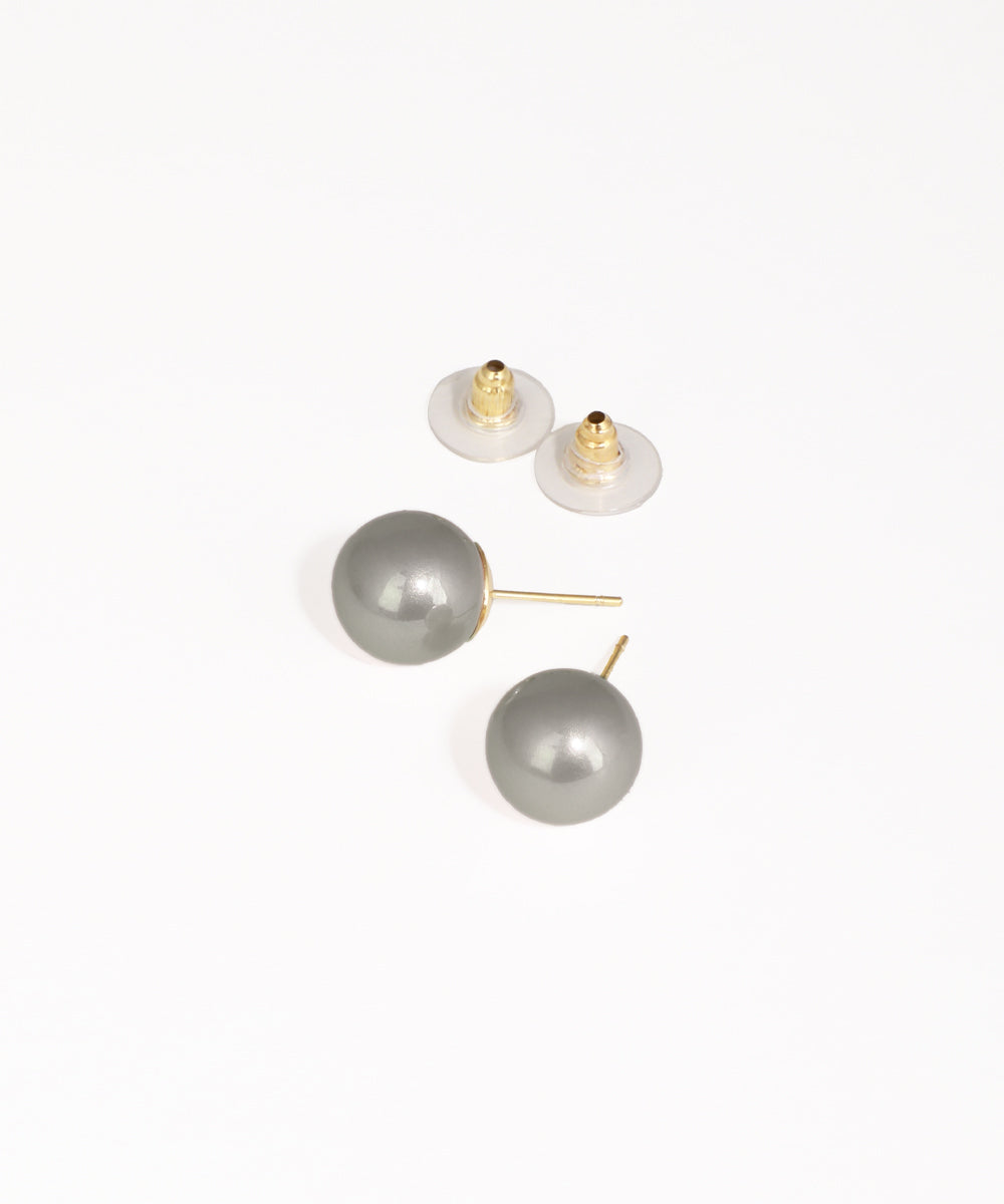 Pair of gray pearl earrings with gold posts on a white background