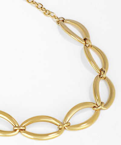 Gold chain necklace on a white background