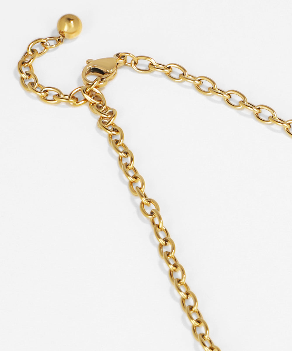 Gold chain bracelet on a white background