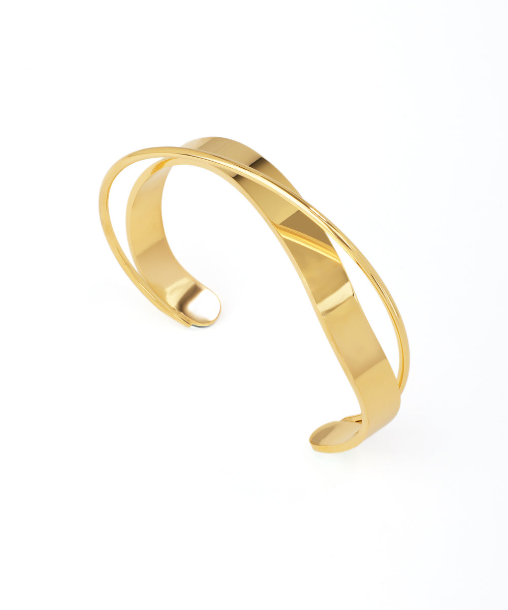 Gold bangle on a white background