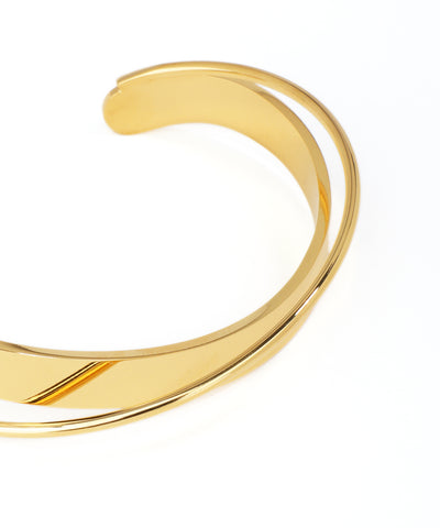 Gold bangle on a white background