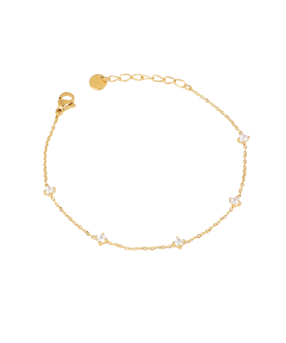 Gold-tone chain bracelet with small, round, clear CZ stones evenly spaced along the chain.
