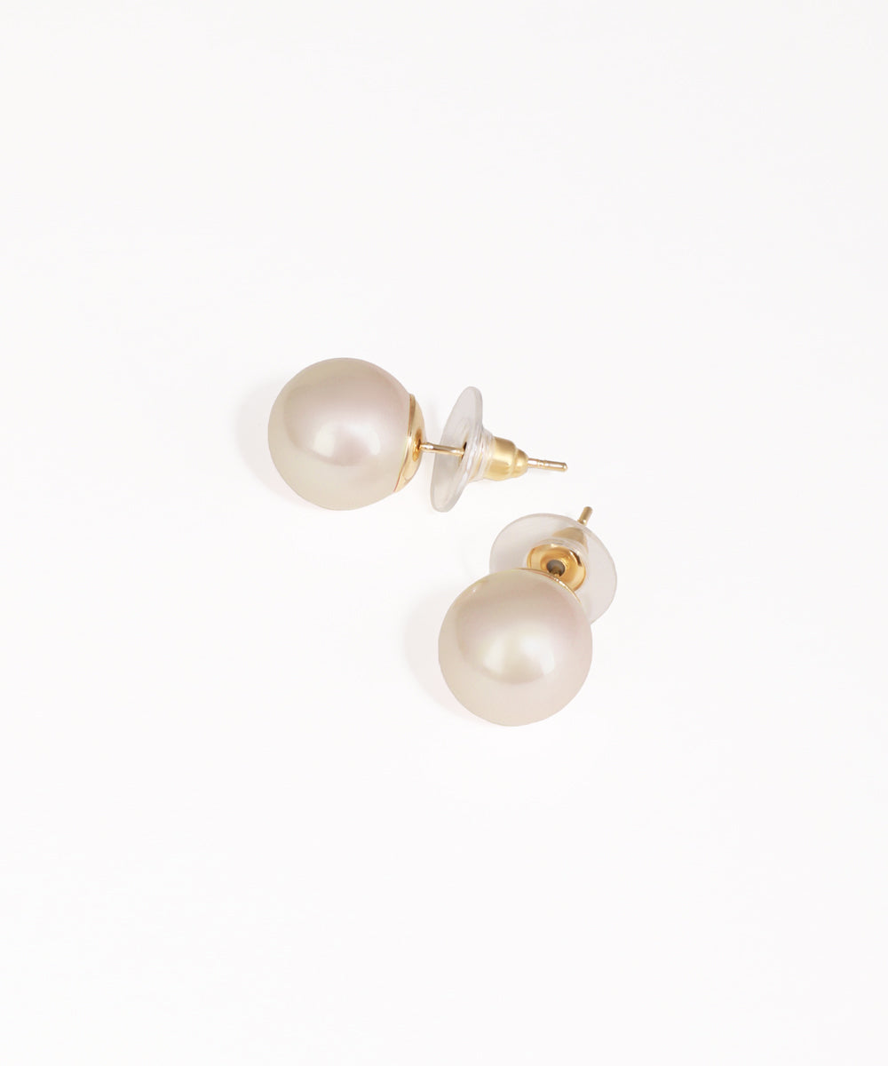 Pair of pearl earrings on a white background