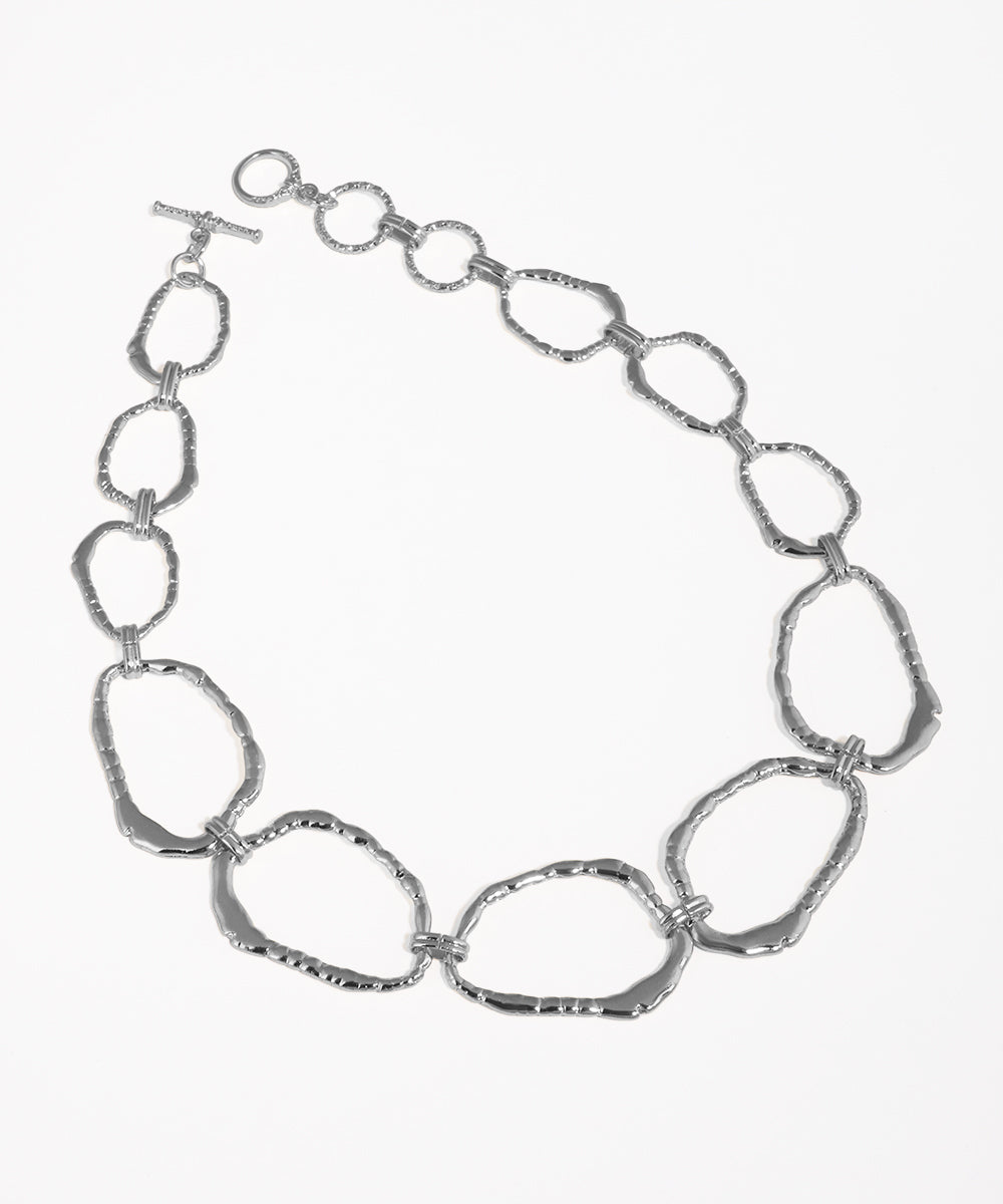 Silver chain necklace on a white background