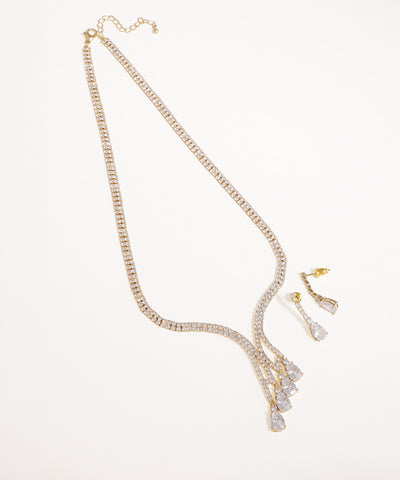 Gold-tone necklace set with brilliant clear stones and cascading teardrop drops on a white background.