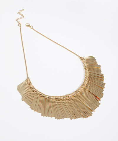 Gold-tone collar necklace with radiating flat bar design and an adjustable extender chain.