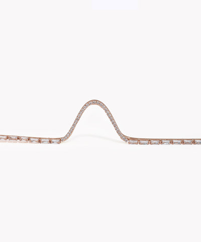 Rose gold bracelet with diamonds on a white background