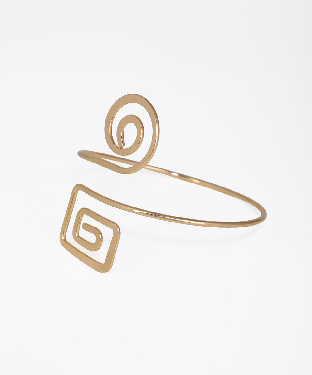 Gold bracelet with geometric design on a light gray background