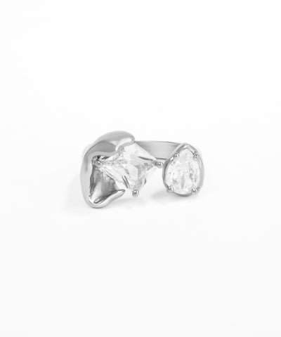 Silver earring with clear gemstone on a white background